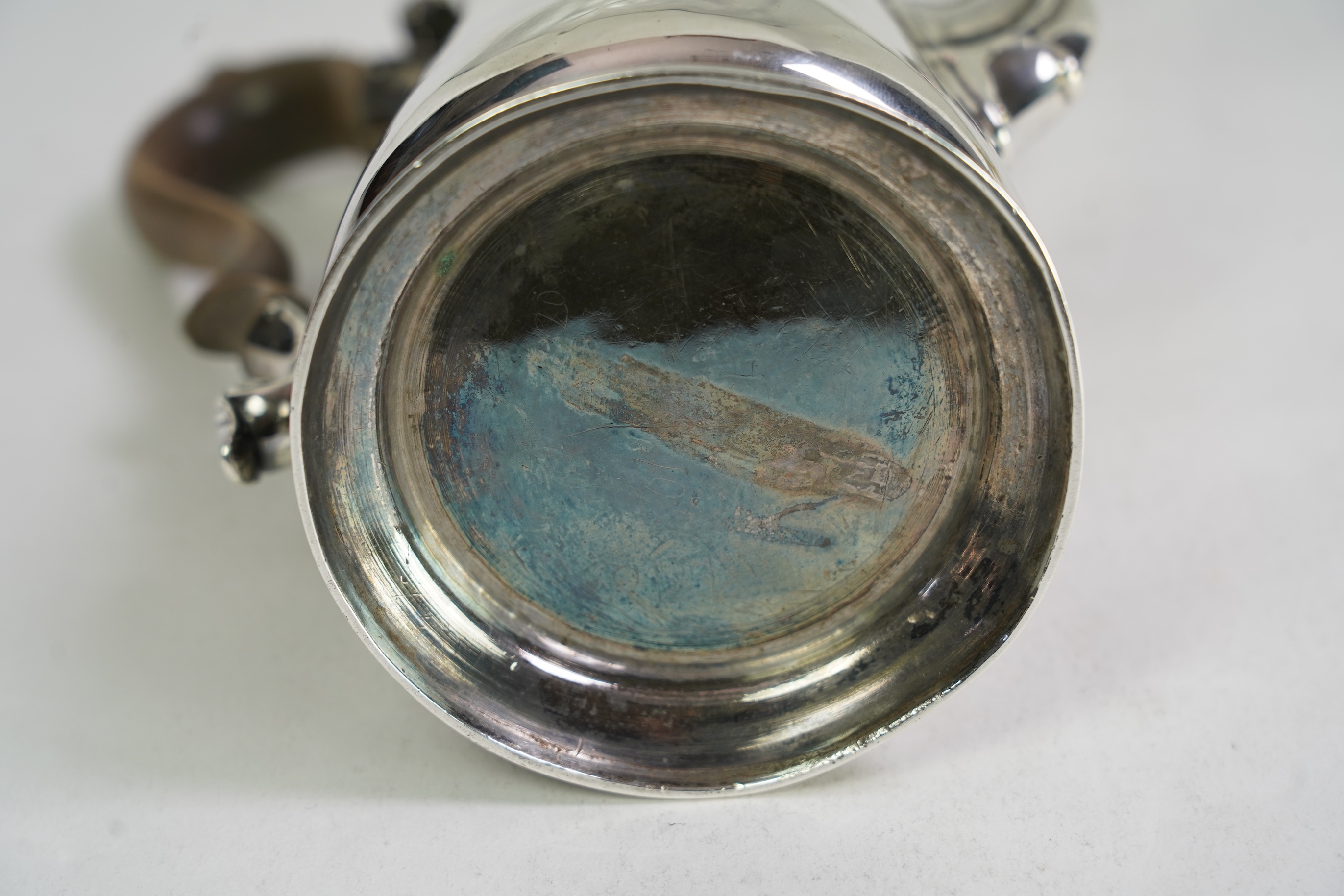 A mid 18th century silver coffee pot, marks very rubbed